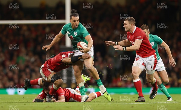 040223 - Wales v Ireland, Guinness Six Nations 2023 - James Lowe of Ireland is tackled by Taulupe Faletau of Wales and Scott Baldwin of Wales