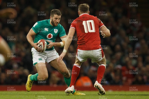 040223 - Wales v Ireland - Guinness Six Nations - Stuart McCloskey of Ireland takes on Dan Biggar of Wales