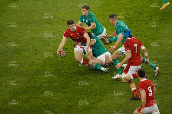 040223 - Wales v Ireland - Guinness Six Nations - Joe Hawkins of Wales is tackled by Andrew Porter of Ireland as he attempts to offload