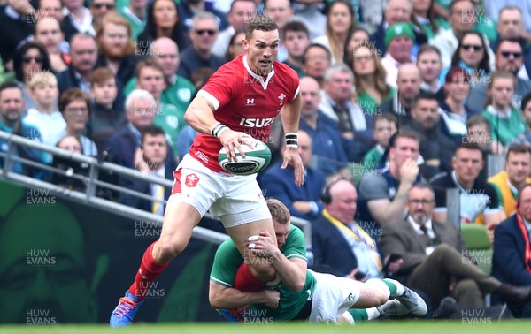 070919 - Ireland v Wales - International Rugby Union - George North of Wales is tackled by Keith Earls of Ireland