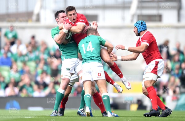 070919 - Ireland v Wales - International Rugby Union - Josh Adams of Wales is tackled by James Ryan and Jordan Larmour of Ireland