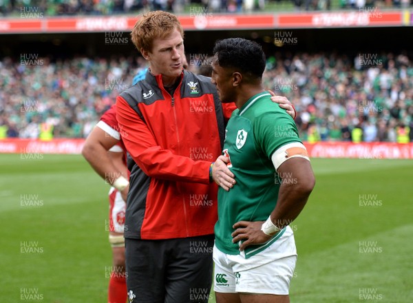 070919 - Ireland v Wales - International Rugby Union - Rhys Patchell of Wales and Bundee Aki of Ireland at the end of the game