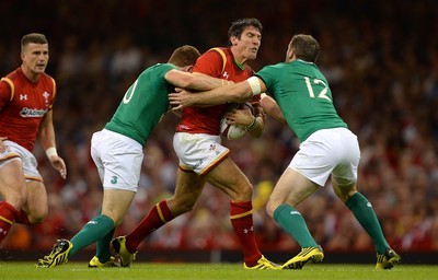 080815 - Wales v Ireland - Dove Men Series 2015 -James Hook of Wales is tackled by Paddy Jackson and Darren Cave of Ireland