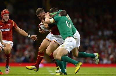 080815 - Wales v Ireland - Dove Men Series 2015 -Scott Williams of Wales is tackled by Jamie Heaslip and Darren Cave of Ireland