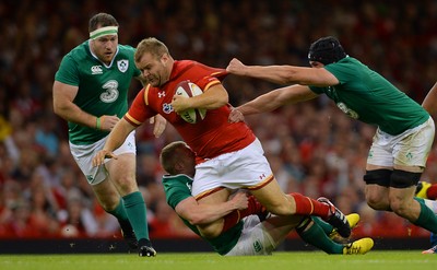 080815 - Wales v Ireland - Dove Men Series 2015 -Scott Andrews of Wales is tackled by Keith Earls and Tommy O'Donnell of Ireland