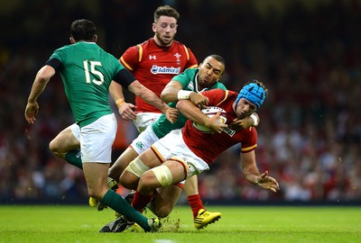 080815 - Wales v Ireland - Dove Men Series 2015 -Justin Tipuric of Wales is tackled by Simon Zebo of Ireland