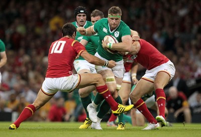 080815 - Wales v Ireland - Dove Mens Series - Jamie Heaslip of Ireland is tackled by James Hook and Mike Phillips of Wales