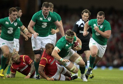 080815 - Wales v Ireland - Dove Mens Series - Jamie Heaslip of Ireland is tackled by Eli Walker of Wales