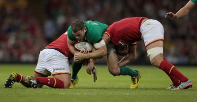 080815 - Wales v Ireland - Dove Mens Series - Keith Earls of Ireland is tackled by Nicky Smith and Eli Walker of Wales