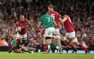 080815 - Wales v Ireland - Dove Mens Series - Eli Walker of Wales is tackled by Darren Cave of Ireland