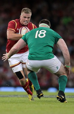 080815 - Wales v Ireland - Dove Mens Series - Gareth Anscombe of Wales is tackled by Michael Bent of Ireland