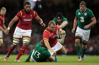 080815 - Wales v Ireland - Dove Mens Series - Scott Andrews of Wales is tackled by Keith Earls of Ireland