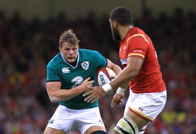 080815 - Wales v Ireland - Dove Men+Care Test - Jordi Murphy of Ireland takes on Taulupe Faletau of Wales