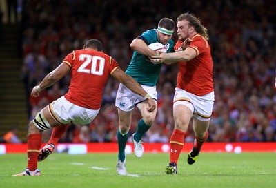 080815 - Wales v Ireland - Dove Men+Care Test - Fergus McFadden of Ireland takes on Taulupe Faletau(L) and Kristian Dacey of Wales