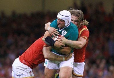 080815 - Wales v Ireland - Dove Men+Care Test - Rory Best of Ireland is tackled by Dominic Day(L) and Kristian Dacey of Wales