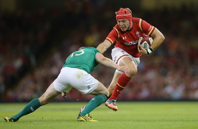 080815 - Wales v Ireland, Dove Men Tests 2015 - Tyler Morgan of Wales looks to hand off Keith Earls of Ireland 