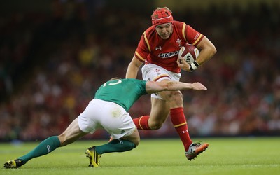 080815 - Wales v Ireland, Dove Men Tests 2015 - Tyler Morgan of Wales looks to hand off Keith Earls of Ireland 