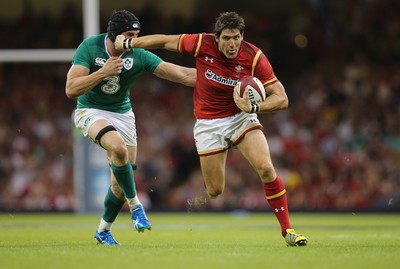 080815 - Wales v Ireland, Dove Men Tests 2015 - James Hook of Wales looks to hold off Tommy O'Donnell of Ireland 