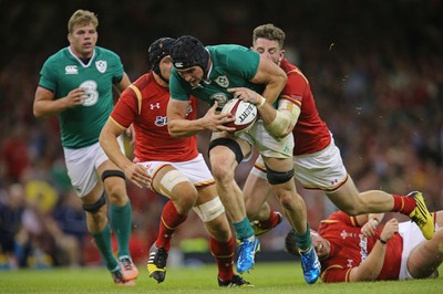 080815 - Wales v Ireland, Dove Men Tests 2015 - Tommy O'Donnell of Ireland  is tackled by Alex Cuthbert of Wales and James King of Wales and is injured as a result