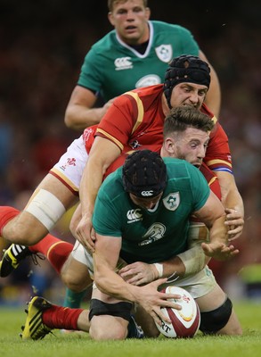 080815 - Wales v Ireland, Dove Men Tests 2015 - Tommy O'Donnell of Ireland  is tackled by Alex Cuthbert of Wales and James King of Wales and is injured as a result