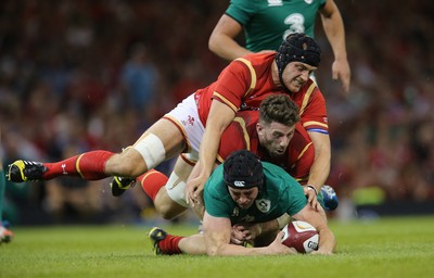 080815 - Wales v Ireland, Dove Men Tests 2015 - Tommy O'Donnell of Ireland  is tackled by Alex Cuthbert of Wales and James King of Wales and is injured as a result