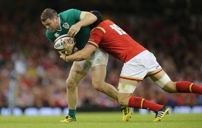 080815 - Wales v Ireland, Dove Men Tests 2015 - Darren Cave of Ireland is tackled by James King of Wales 