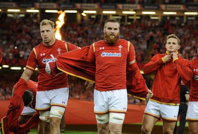 080815 - Wales v Ireland - Dove Men Series - Dominic Day, jake Ball and Hallam Amos of Wales remove their jackets to reveal the new World Cup shirt