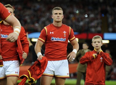 080815 - Wales v Ireland - Dove Men Series - Scott Williams of Wales removes his jacket to reveal the new World Cup shirt