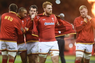 080815 - Wales v Ireland - Dove Men Series - Dan Baker of Wales removes his jacket to reveal the new World Cup shirt