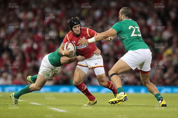 080815 - Wales v Ireland - Dove Mens Series - Matthew Morgan of Wales is tackled by Felix Jones and Simon Zebo of Ireland