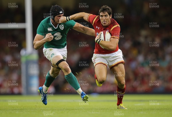 080815 - Wales v Ireland, Dove Men Tests 2015 - James Hook of Wales looks to hold off Tommy O'Donnell of Ireland 