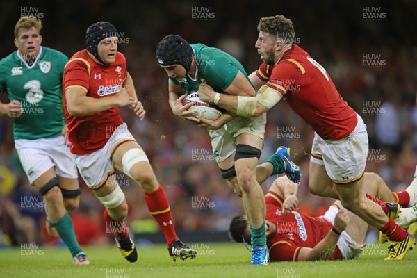 080815 - Wales v Ireland, Dove Men Tests 2015 - Tommy O'Donnell of Ireland  is tackled by Alex Cuthbert of Wales and James King of Wales and is injured as a result