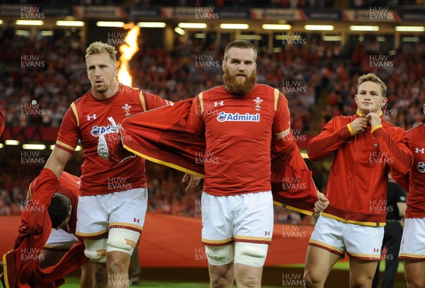 080815 - Wales v Ireland - Dove Men Series - Dominic Day, jake Ball and Hallam Amos of Wales remove their jackets to reveal the new World Cup shirt