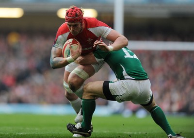 12.03.11 - Wales v Ireland - RBS Six Nations 2011 - Alun Wyn Jones of Wales is tackled by Gordon D'Arcy of Ireland. 