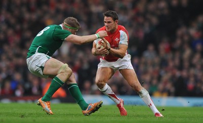 12.03.11 - Wales v Ireland - RBS Six Nations 2011 - Lee Byrne of Wales is tackled by Jamie Heaslip of Ireland. 