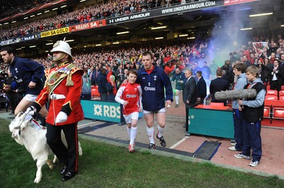 12.03.11 - Wales v Ireland - RBS Six Nations 2011 - Matthew Rees of Wales leads his team onto the field with mascot Tomas Rees. 