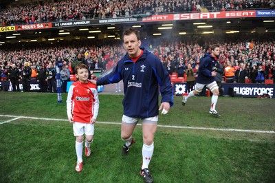 12.03.11 - Wales v Ireland - RBS Six Nations 2011 - Matthew Rees of Wales leads his team onto the field with mascot Tomas Rees. 