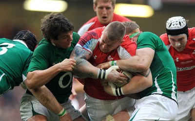 12.03.11 - Wales v Ireland - RBS Six Nations 2011 - John Yapp of Wales is tackled Donnacha O'Callaghan and Jamie Heaslip of Ireland. 