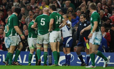12.03.11 - Wales v Ireland - RBS Six Nations 2011 - Ireland players confront referee Jonathan Kaplan and Touch judge Petter Allan after Mike Phillips of Wales scores try. 