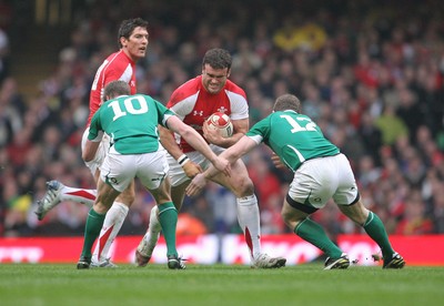 12.03.11 Wales v Ireland ... Wales Jamie Roberts is tackled by Ireland's Ronan O'Gara and  Gordon D'Arcy. 