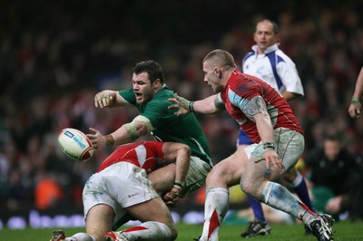 12.03.11 Wales v Ireland ... Ireland's Cian Healy drops the ball and stops the Irish attack in the dying moments as John Yapp gets ready to reclaim the ball for Wales. 