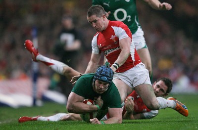 12.03.11 Wales v Ireland ... Ireland's Sean O'Brien is brought down by Lee Byrne. 