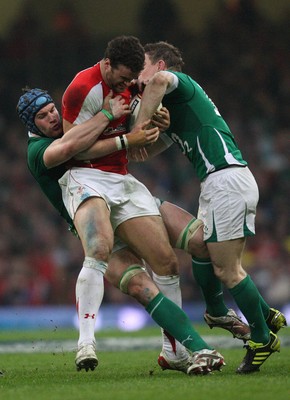 12.03.11... Wales v Ireland, RBS 6 Nations -  Wales' Jamie Roberts is tackled by Ireland's Brian O'Driscoll and Ireland's Sean O'Brien  