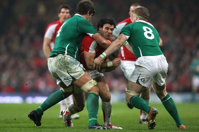 12.03.11... Wales v Ireland, RBS 6 Nations -  Wales' Mike Phillips is tackled by Ireland's Donncha O'Callaghan and Jamie Heaslip  