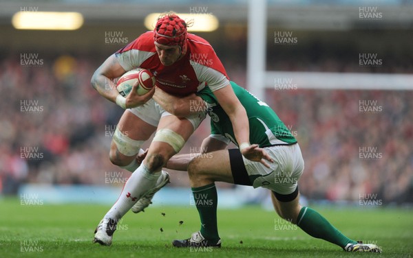 12.03.11 - Wales v Ireland - RBS Six Nations 2011 - Alun Wyn Jones of Wales is tackled by Gordon D'Arcy of Ireland. 