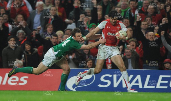 12.03.11 - Wales v Ireland - RBS Six Nations 2011 - Mike Phillips of Wales holds off Tommy Bowe of Ireland to score try. 