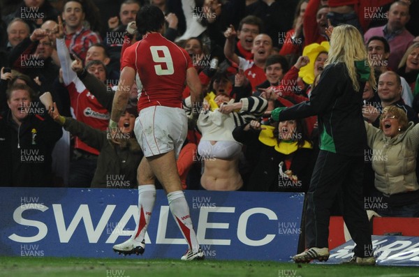 12.03.11 - Wales v Ireland - RBS Six Nations 2011 - A Welsh fan shows her support for Mike Phillips after he scores try. 