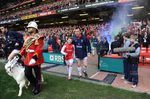 12.03.11 - Wales v Ireland - RBS Six Nations 2011 - Matthew Rees of Wales leads his team onto the field with mascot Tomas Rees. 