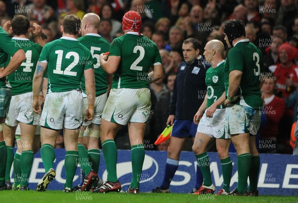 12.03.11 - Wales v Ireland - RBS Six Nations 2011 - Ireland players confront referee Jonathan Kaplan and Touch judge Petter Allan after Mike Phillips of Wales scores try. 