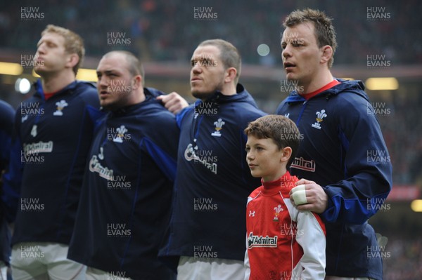 12.03.11 - Wales v Ireland - RBS Six Nations 2011 - Bradley Davies, Craig Mitchell, Paul James and Matthew Rees line-up for the national anthems with match mascot Tomas Rees. 
